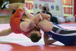 What is the difference between folkstyle and freestyle wrestling?